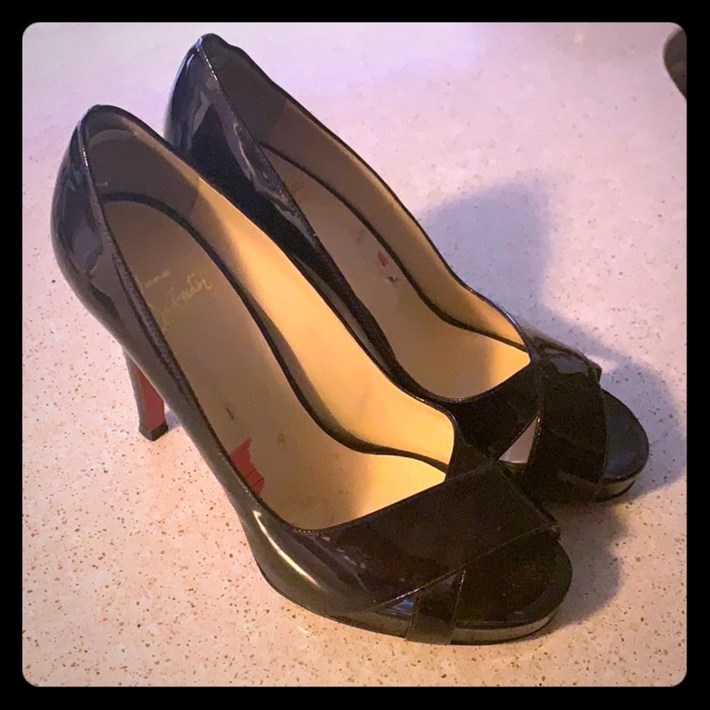 37.5 maroon Christian Louboutin knock out heels.